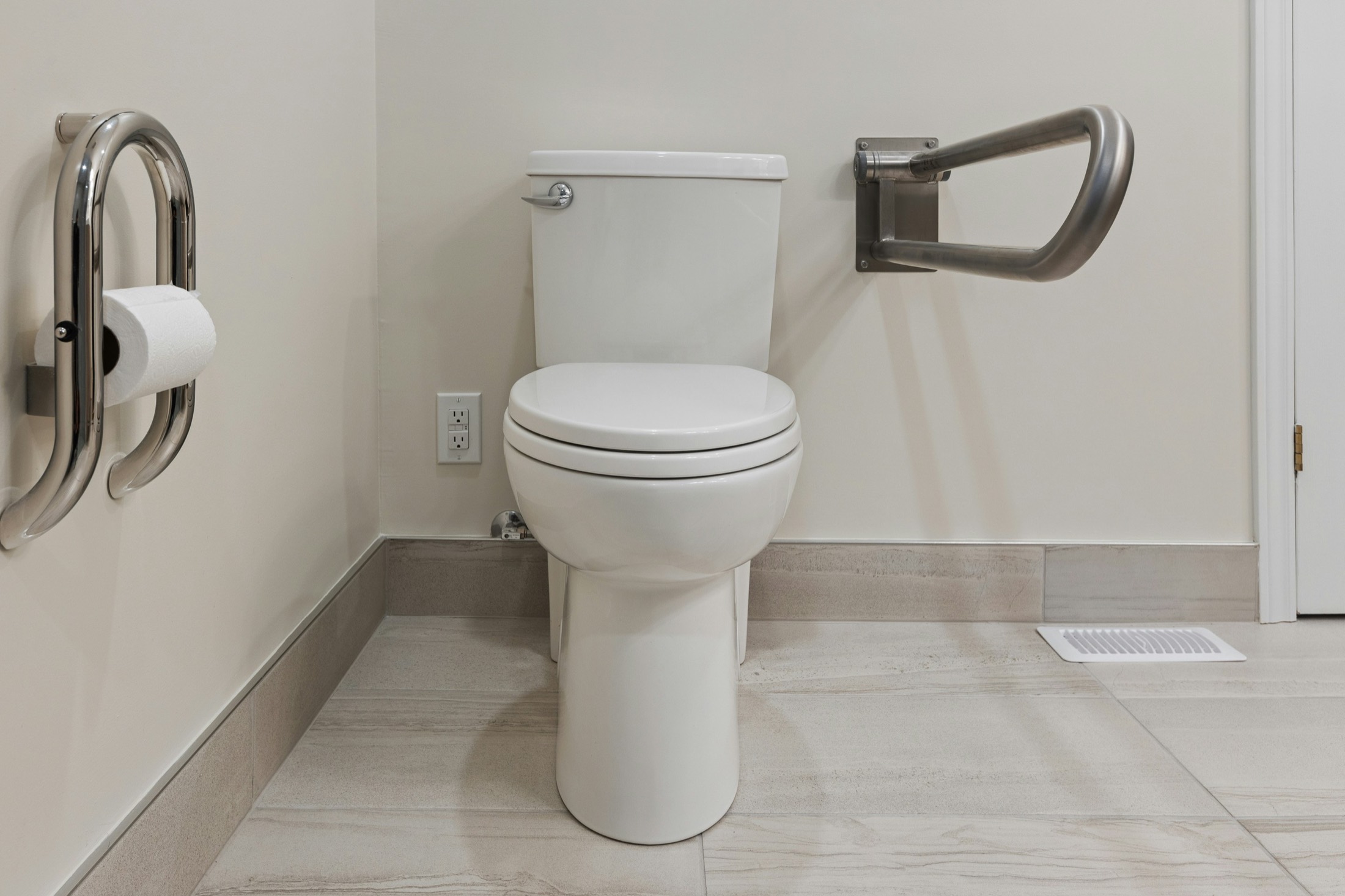 Accessible toilet area with grab bars