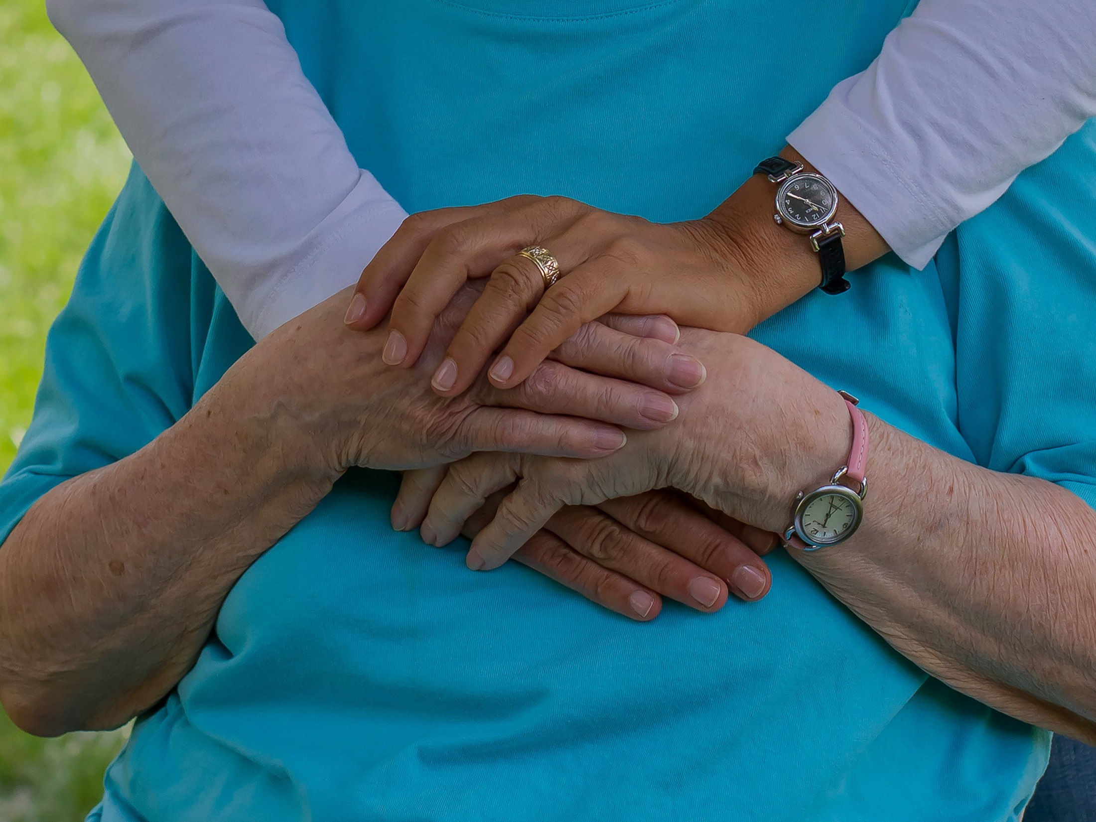 Caregiver hands helping with support