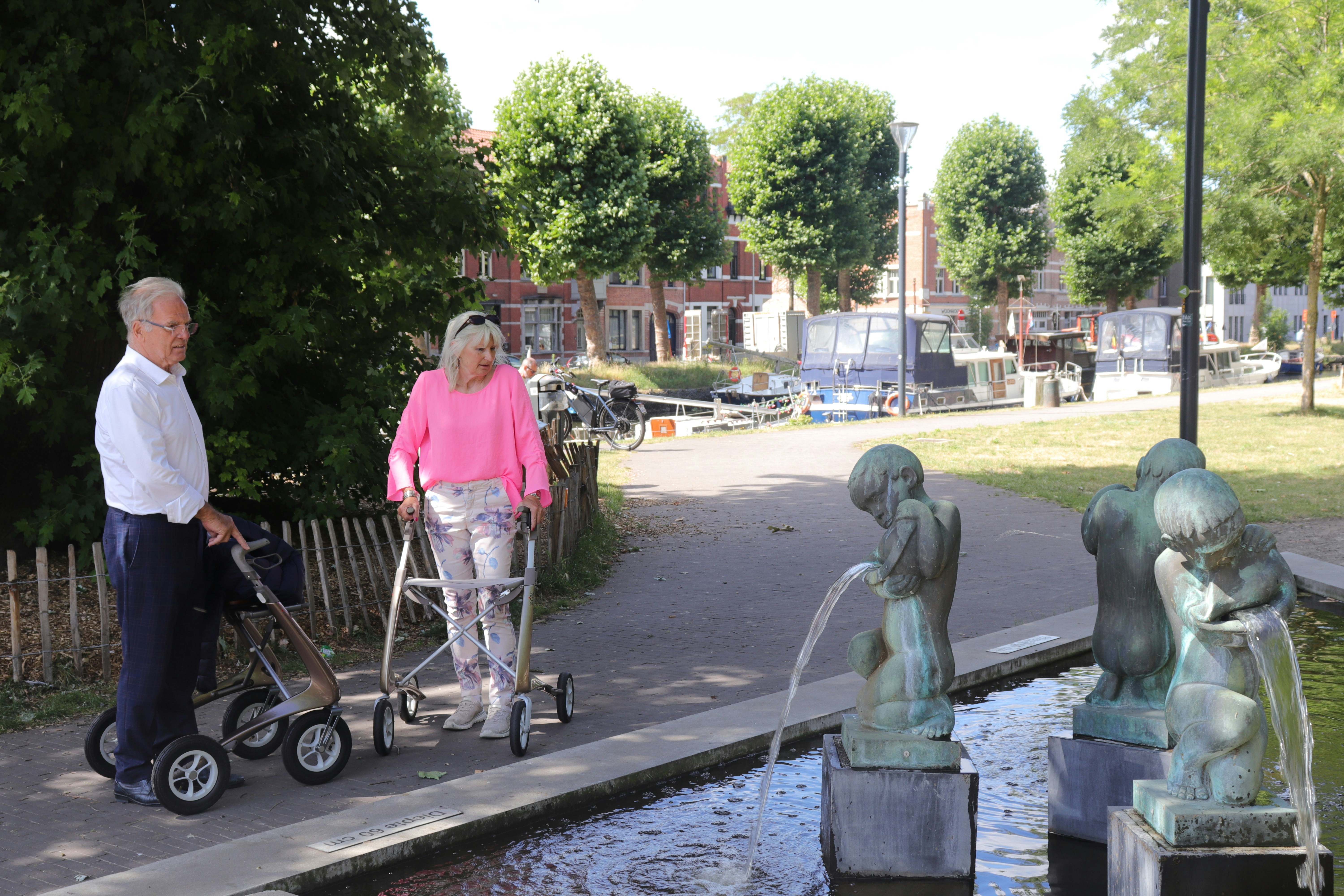 Person using a rollator outdoors in an urban setting