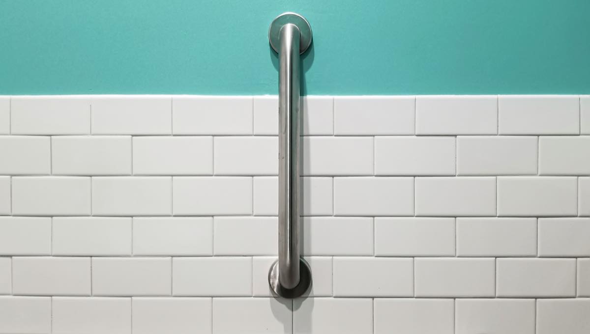 Grab bar installed on tiled bathroom wall
