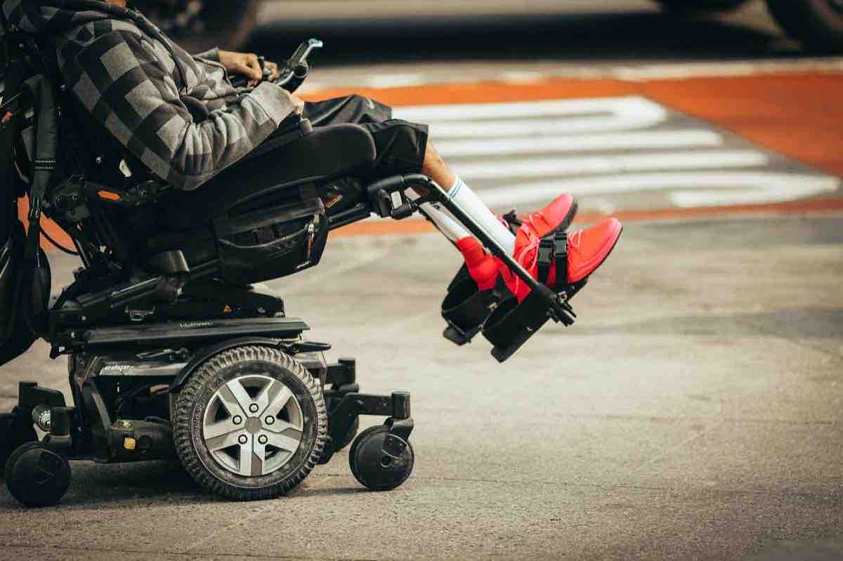 Power wheelchair on an urban street