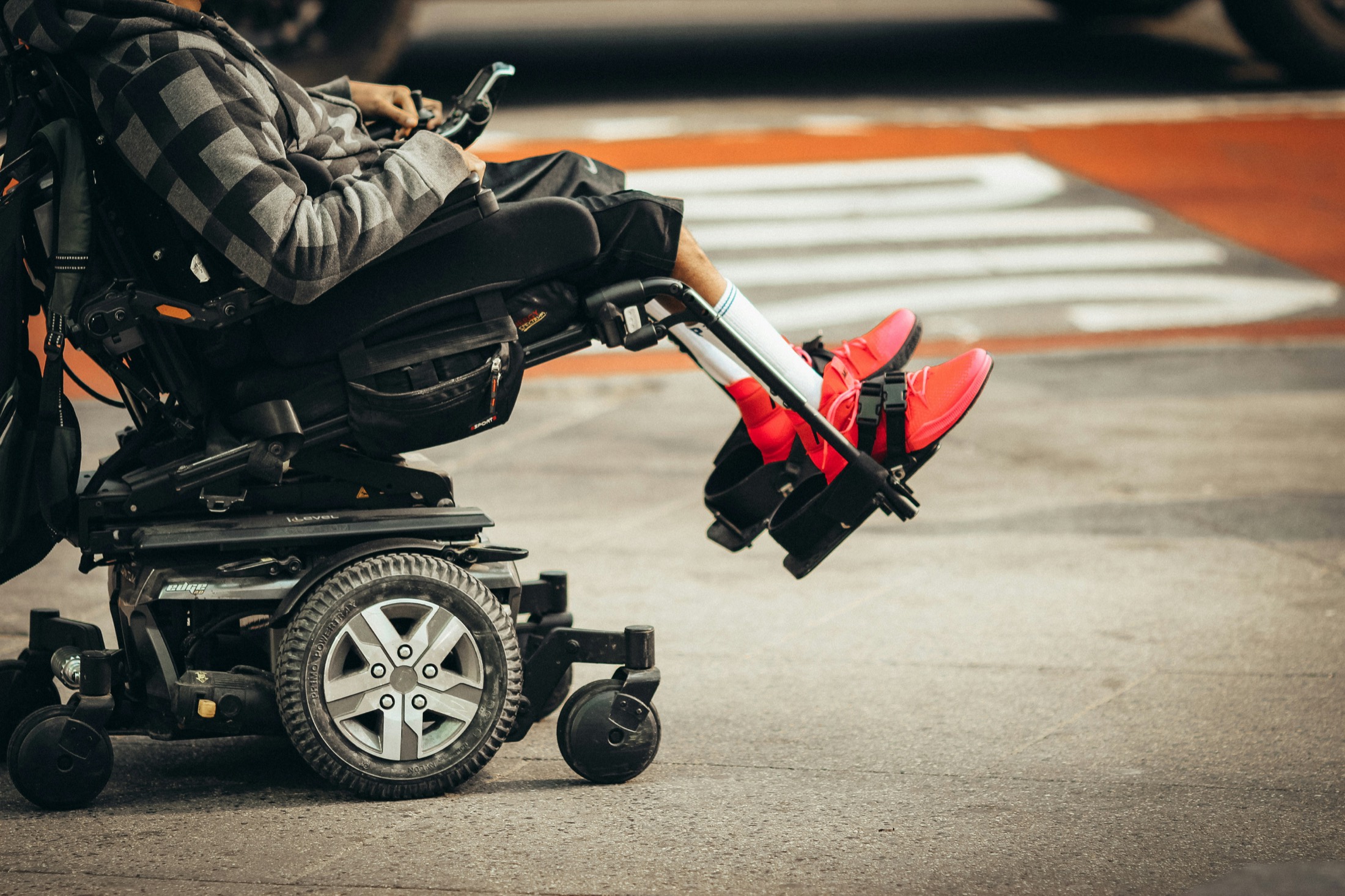 Power wheelchair on an urban street